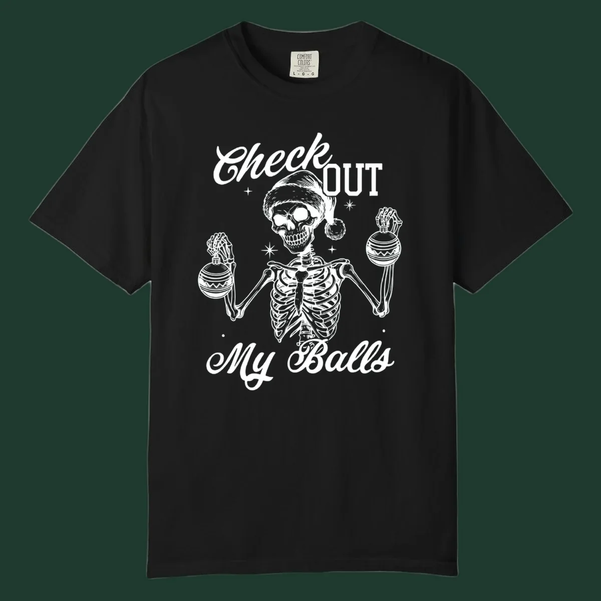 Skeleton wearing a Santa hat and holding Christmas ornaments, with text 'Check OUT My Balls'.