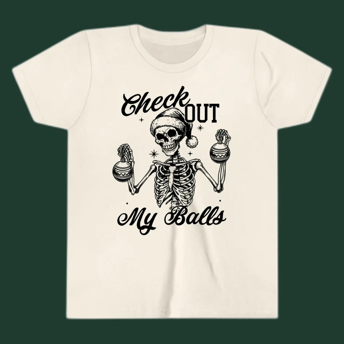 Skeleton wearing a Santa hat and holding Christmas ornaments, with text 'Check OUT My Balls'.