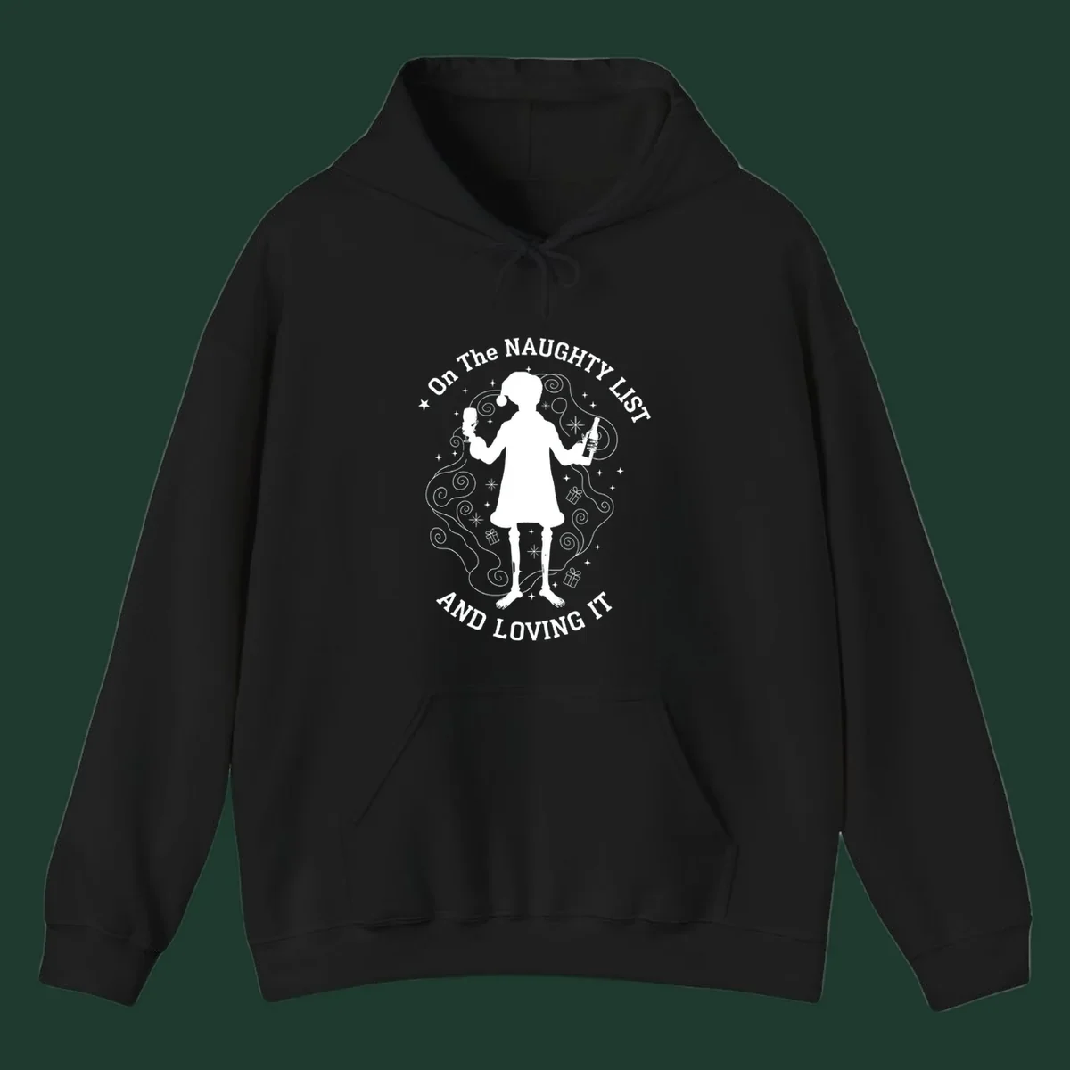 Silhouette of person in Santa hat holding wine, text 'Naughty List And Loving It'.
