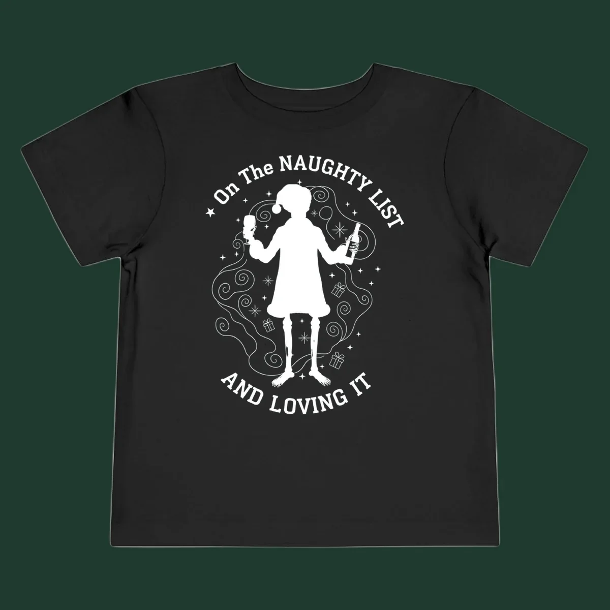 Silhouette of person in Santa hat holding wine, text 'Naughty List And Loving It'.
