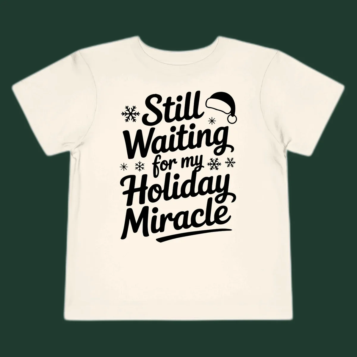 Text reading "Still Waiting for my Holiday Miracle" with snowflakes and a Santa hat graphic.