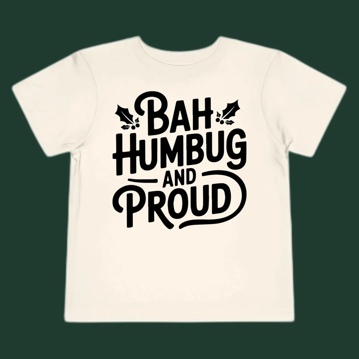 Bah humbug and proud typography design with holly leaves.