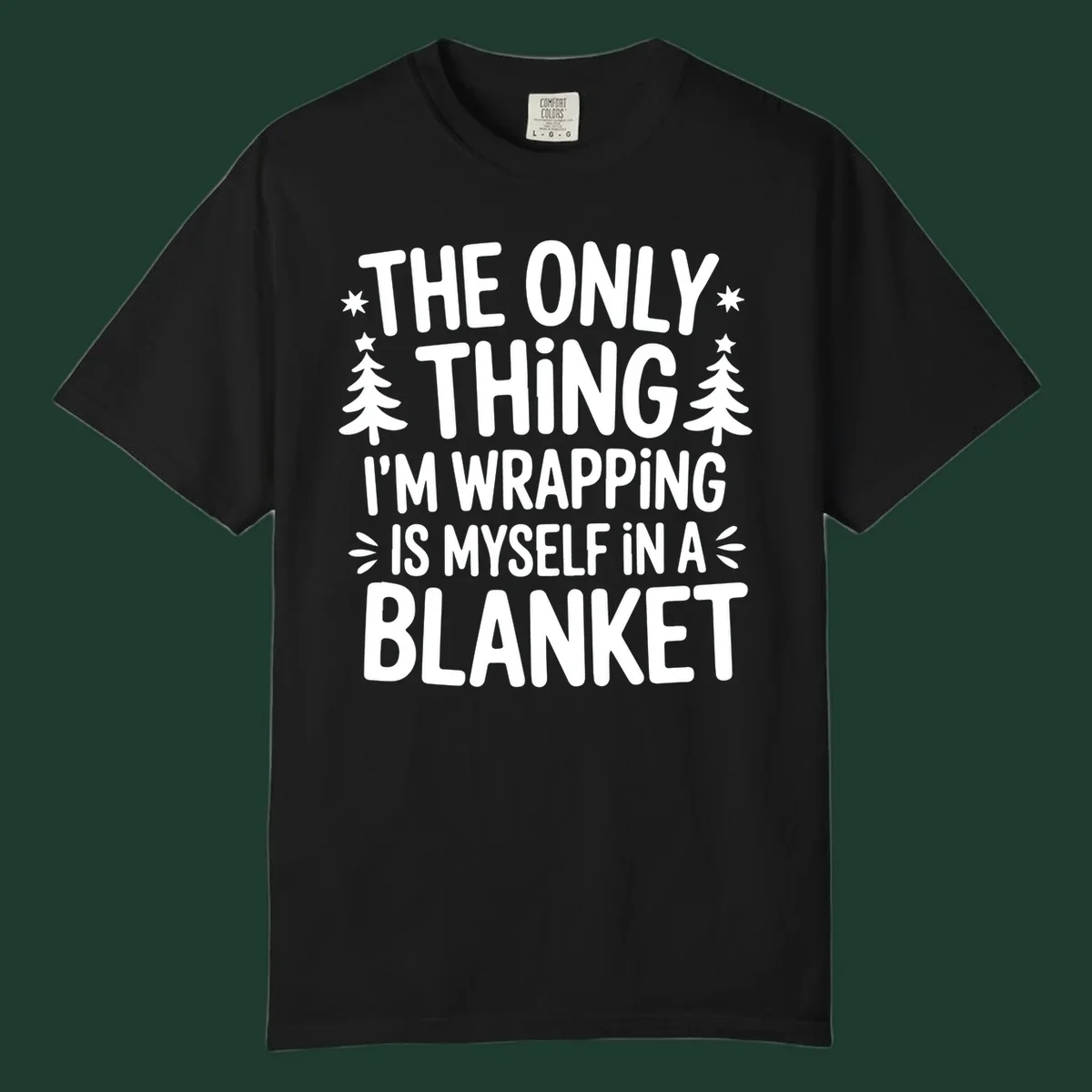 The Only Thing I'm Wrapping Is Myself In A Blanket text design with stars and Christmas trees.