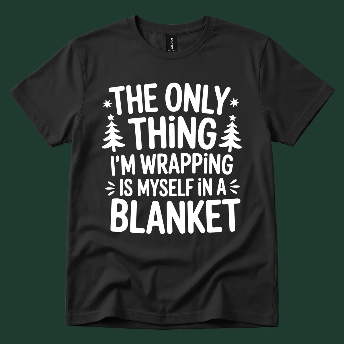 The Only Thing I'm Wrapping Is Myself In A Blanket text design with stars and Christmas trees.