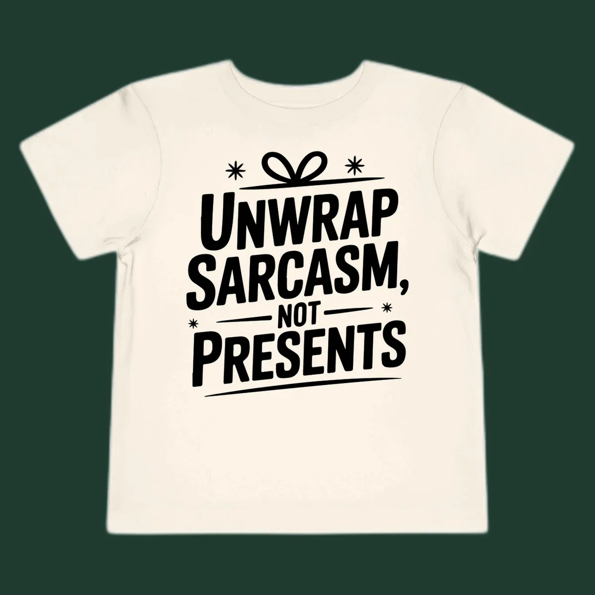 Unwrap Sarcasm Not Presents text design with snowflakes and gift ribbon.