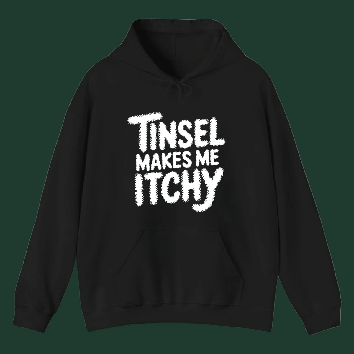 Text design reading "Tinsel Makes Me Itchy" in a fuzzy font.