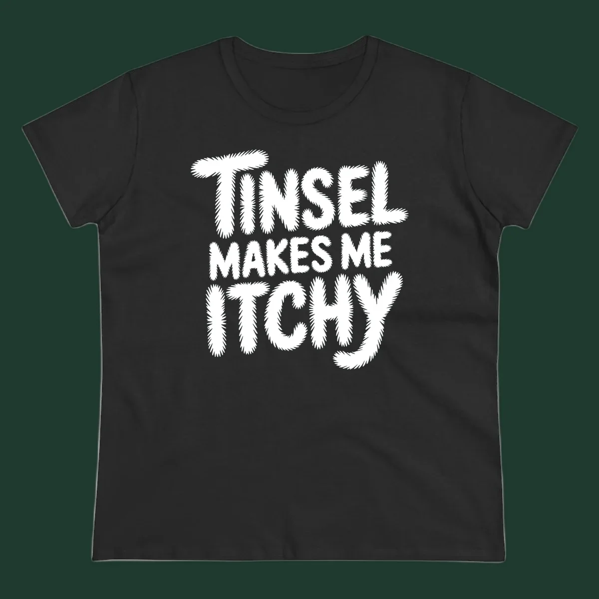 Text design reading "Tinsel Makes Me Itchy" in a fuzzy font.