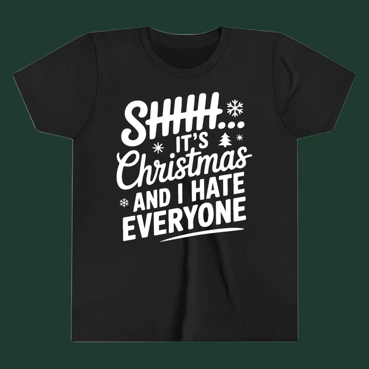 Shhh It's Christmas And I Hate Everyone text design with snowflake and tree graphics.
