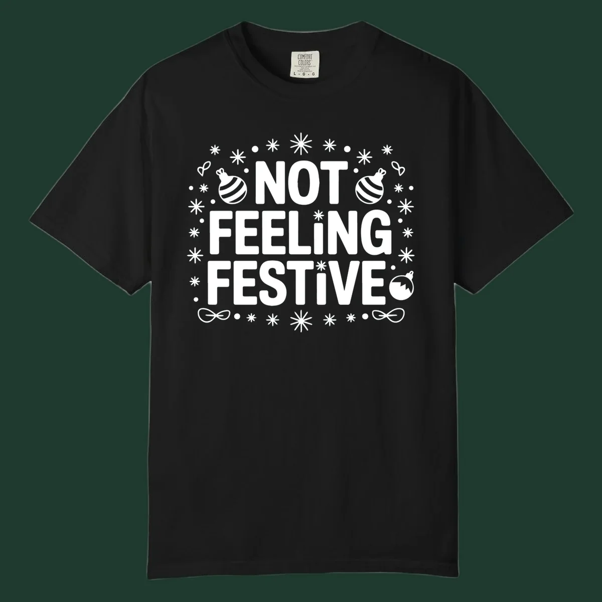 Not feeling festive graphic tee with text and winter elements.