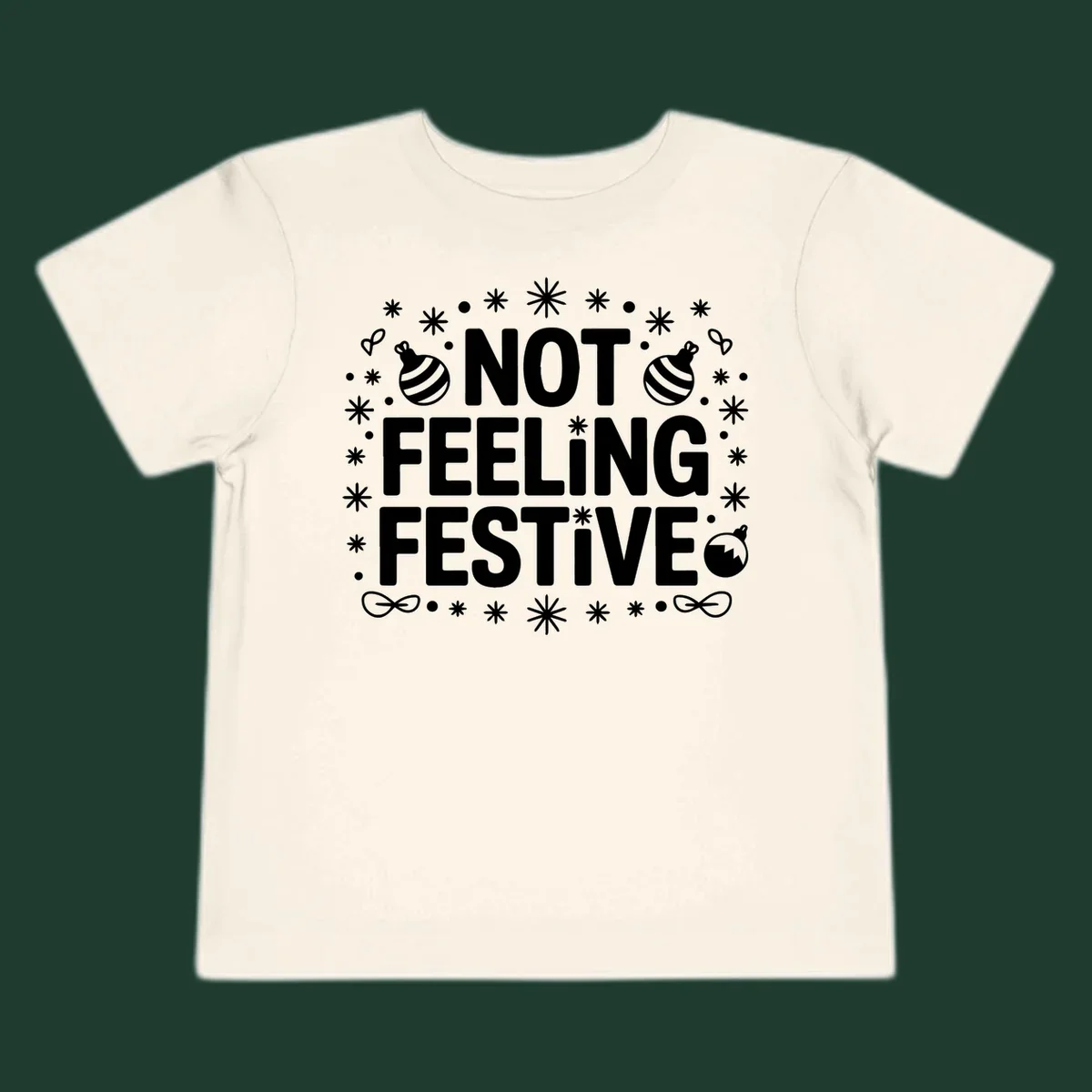 Not feeling festive graphic tee with text and winter elements.