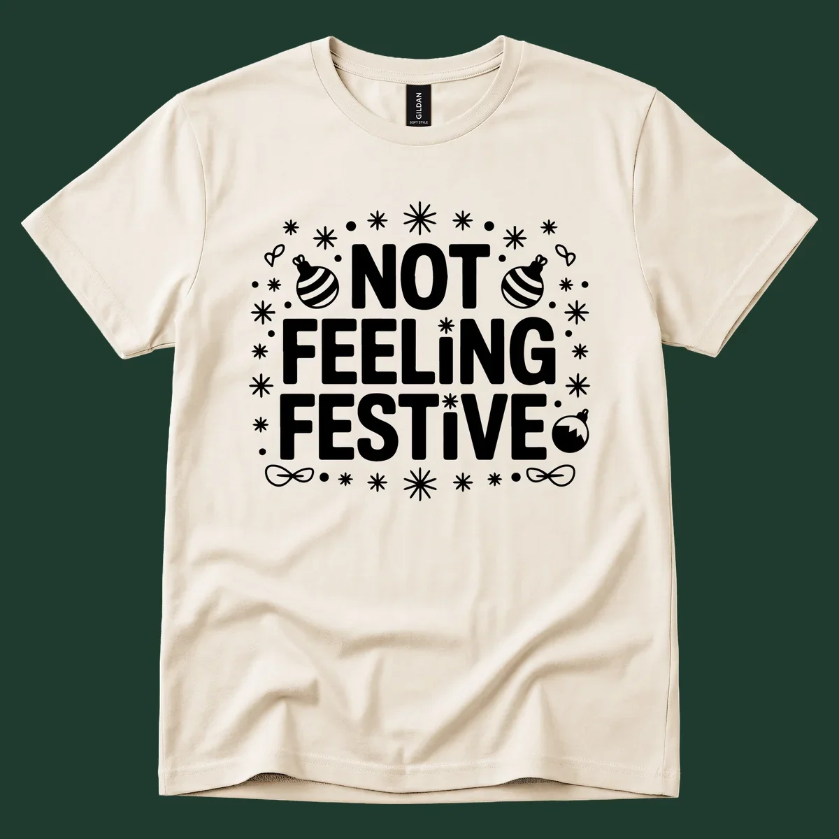 Not feeling festive graphic tee with text and winter elements.