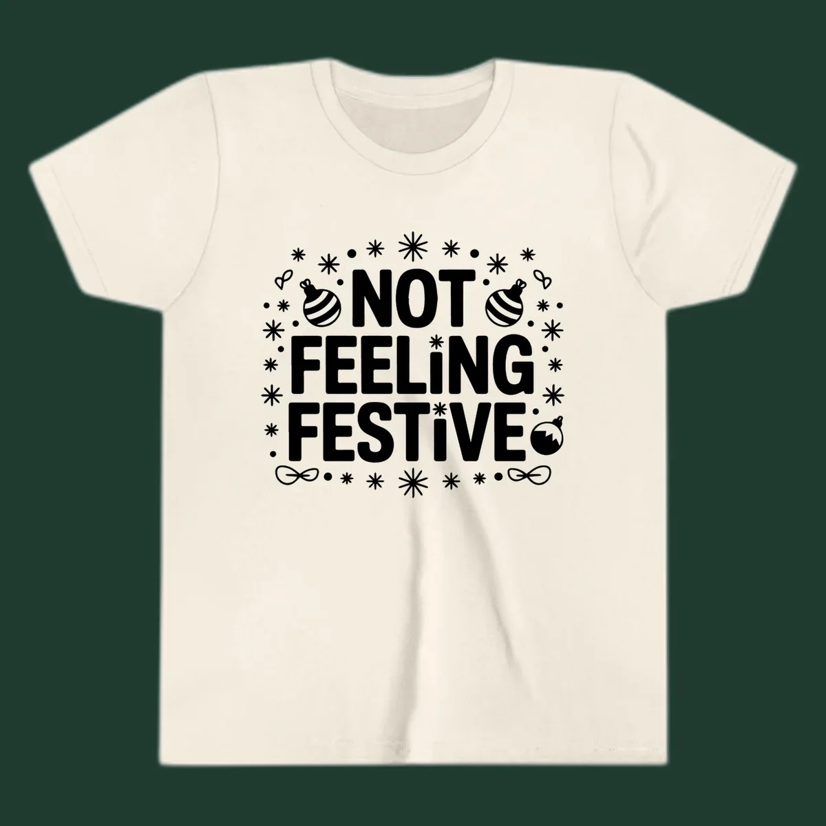 Not feeling festive graphic tee with text and winter elements.