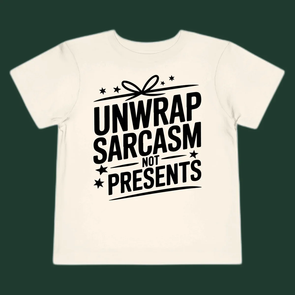Unwrap Sarcasm Not Presents typography design with gift bow and stars.