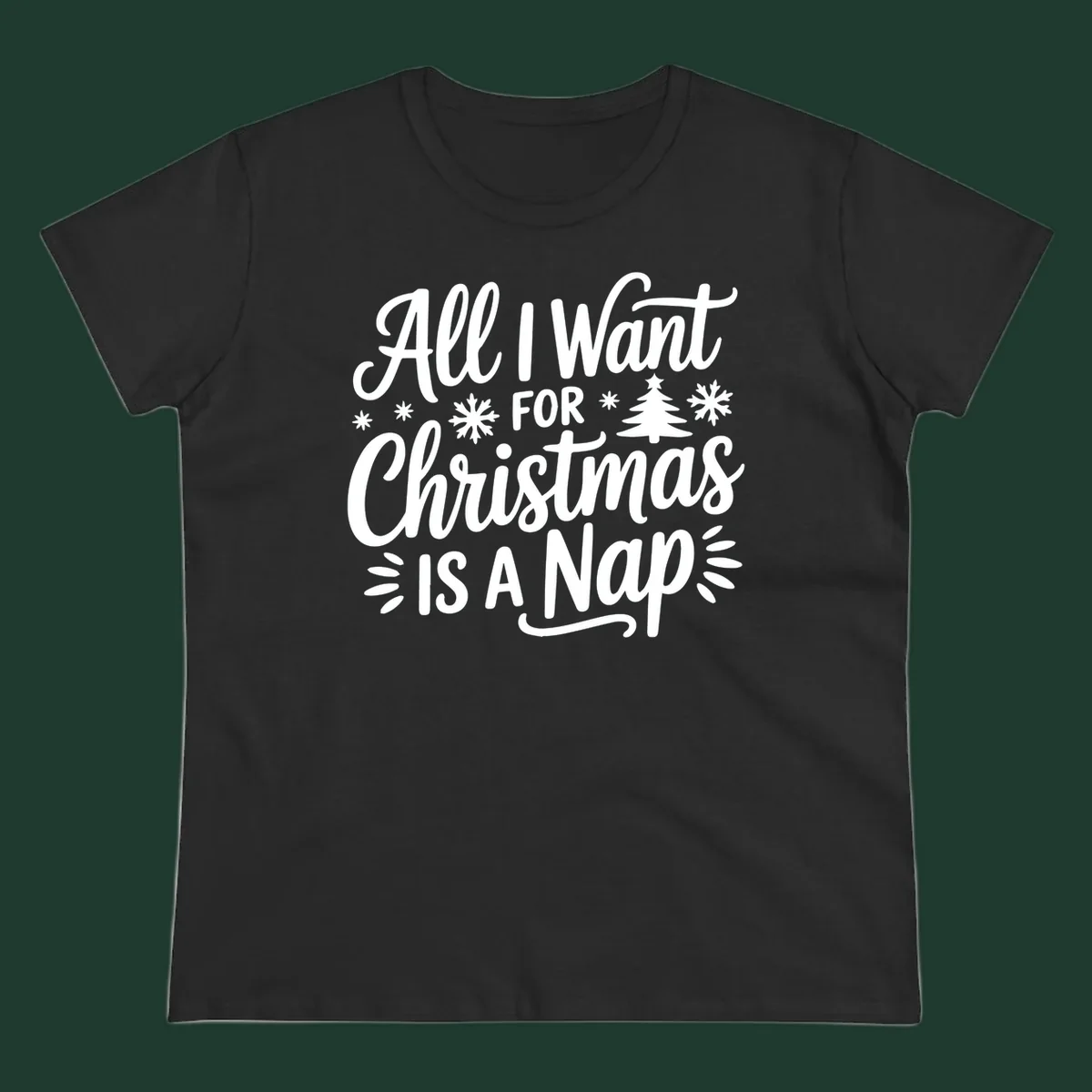 All I Want For Christmas Is A Nap typographic design with snowflakes and a Christmas tree.