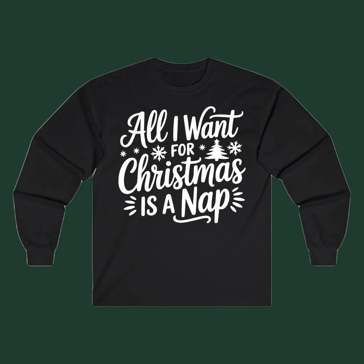 All I Want For Christmas Is A Nap typographic design with snowflakes and a Christmas tree.