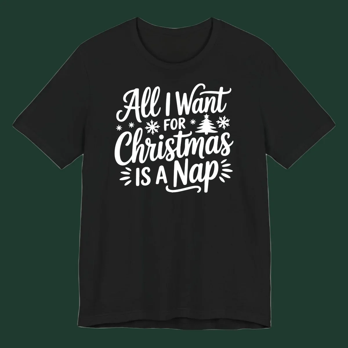 All I Want For Christmas Is A Nap typographic design with snowflakes and a Christmas tree.