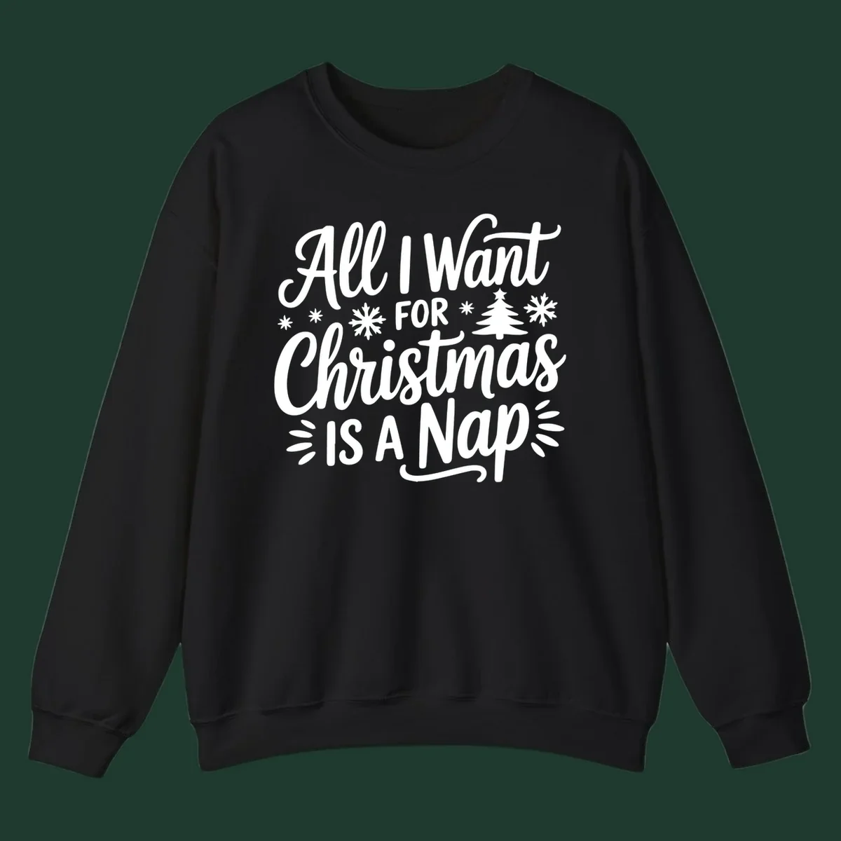 All I Want For Christmas Is A Nap typographic design with snowflakes and a Christmas tree.