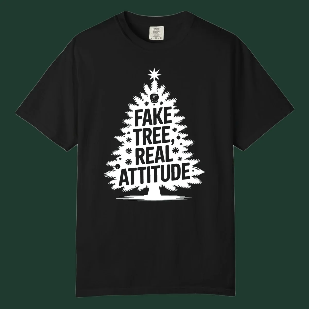 Fake tree, real attitude Christmas graphic with a stylized tree and bold text.