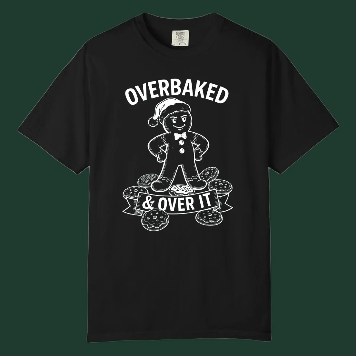 Overbaked gingerbread man with Santa hat and cookies, text says OVERBAKED & OVER IT.