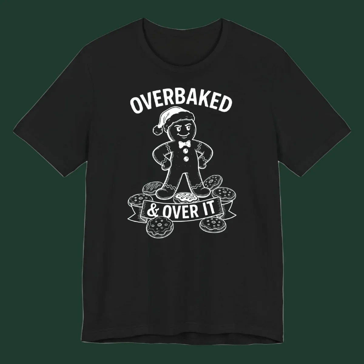 Overbaked gingerbread man with Santa hat and cookies, text says OVERBAKED & OVER IT.