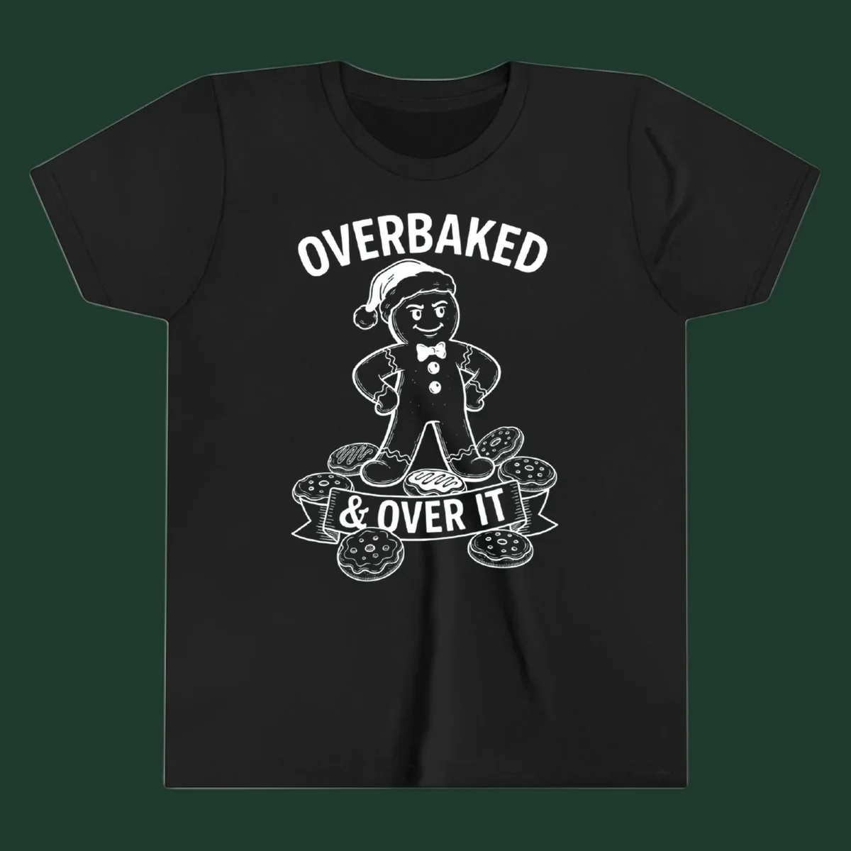 Overbaked gingerbread man with Santa hat and cookies, text says OVERBAKED & OVER IT.
