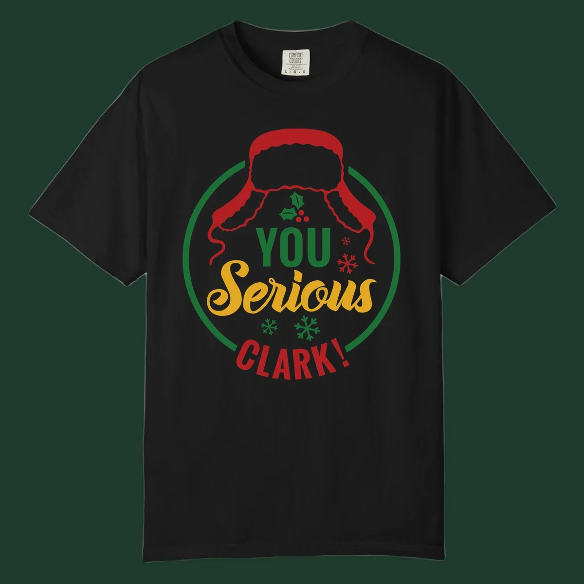 Christmas Clark quote graphic with a hat, holly, and snowflakes.