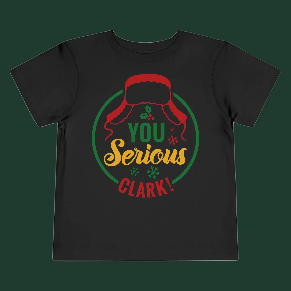 Christmas Clark quote graphic with a hat, holly, and snowflakes.