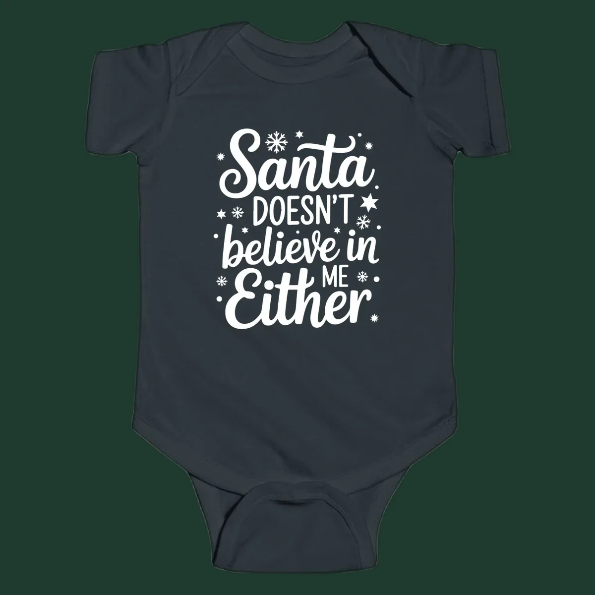 Typography design that reads Santa DOESN'T believe in ME Either, with snowflakes and stars.