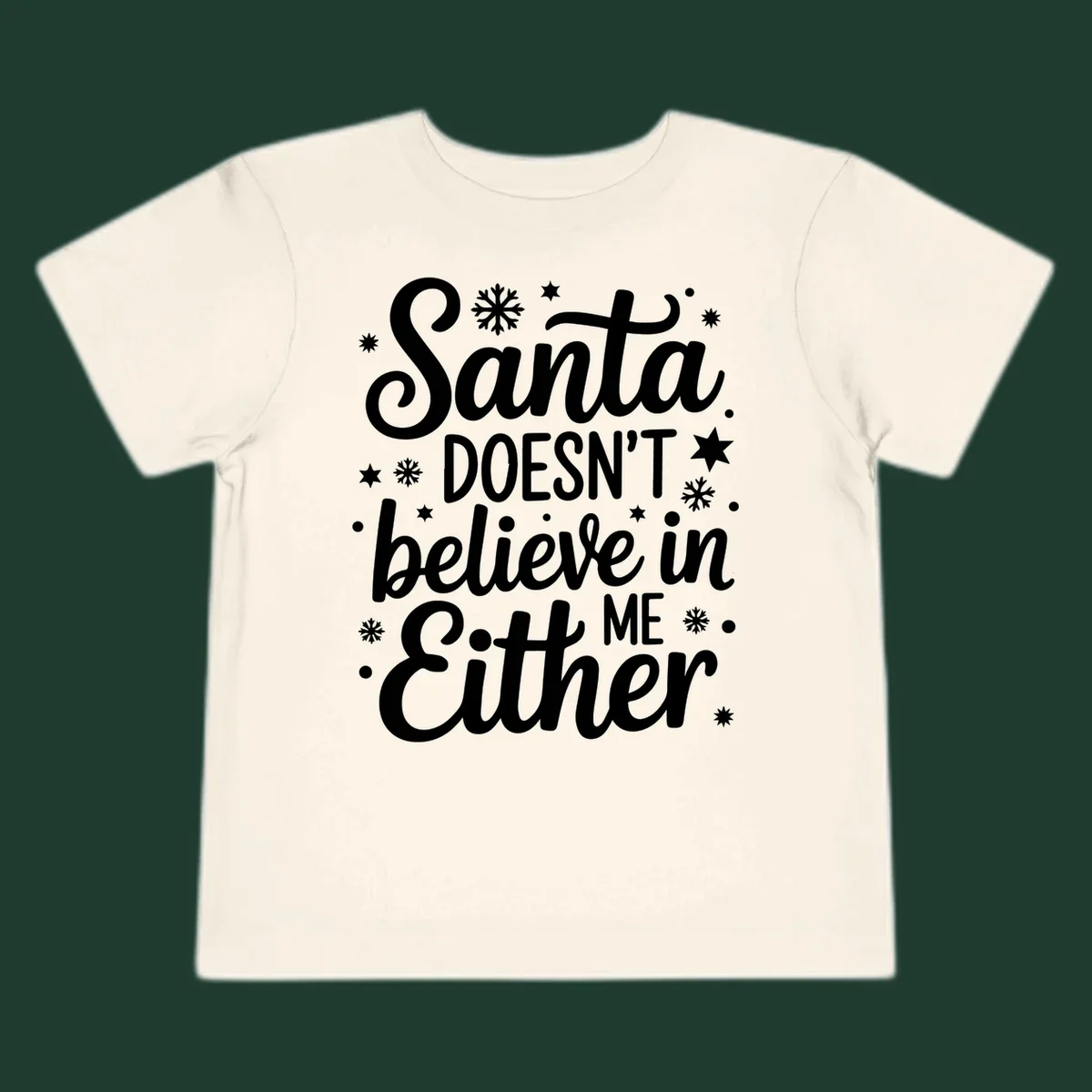 Typography design that reads Santa DOESN'T believe in ME Either, with snowflakes and stars.