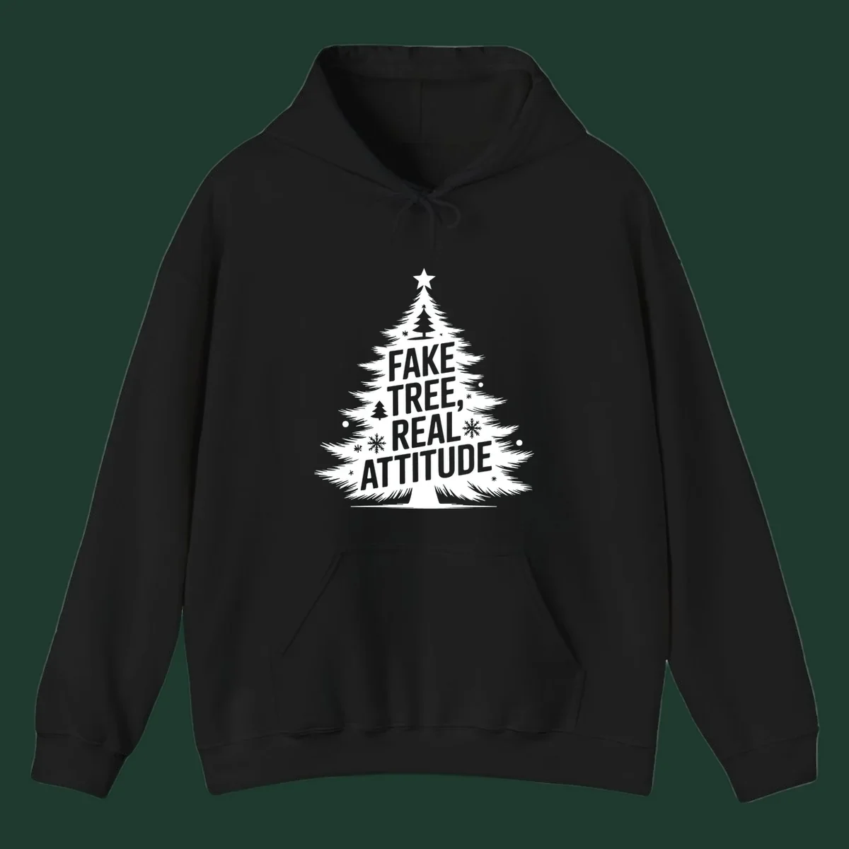 Christmas tree graphic with text 'FAKE TREE, REAL ATTITUDE' and snowflake accents.