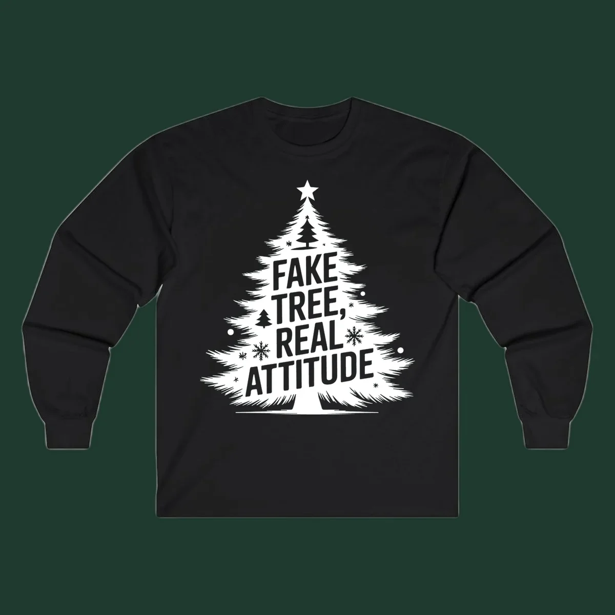 Christmas tree graphic with text 'FAKE TREE, REAL ATTITUDE' and snowflake accents.