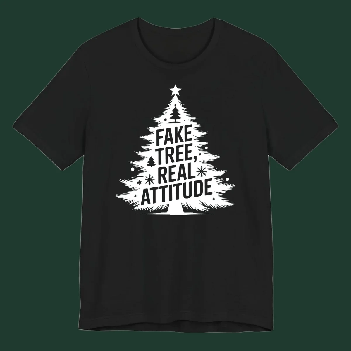 Christmas tree graphic with text 'FAKE TREE, REAL ATTITUDE' and snowflake accents.