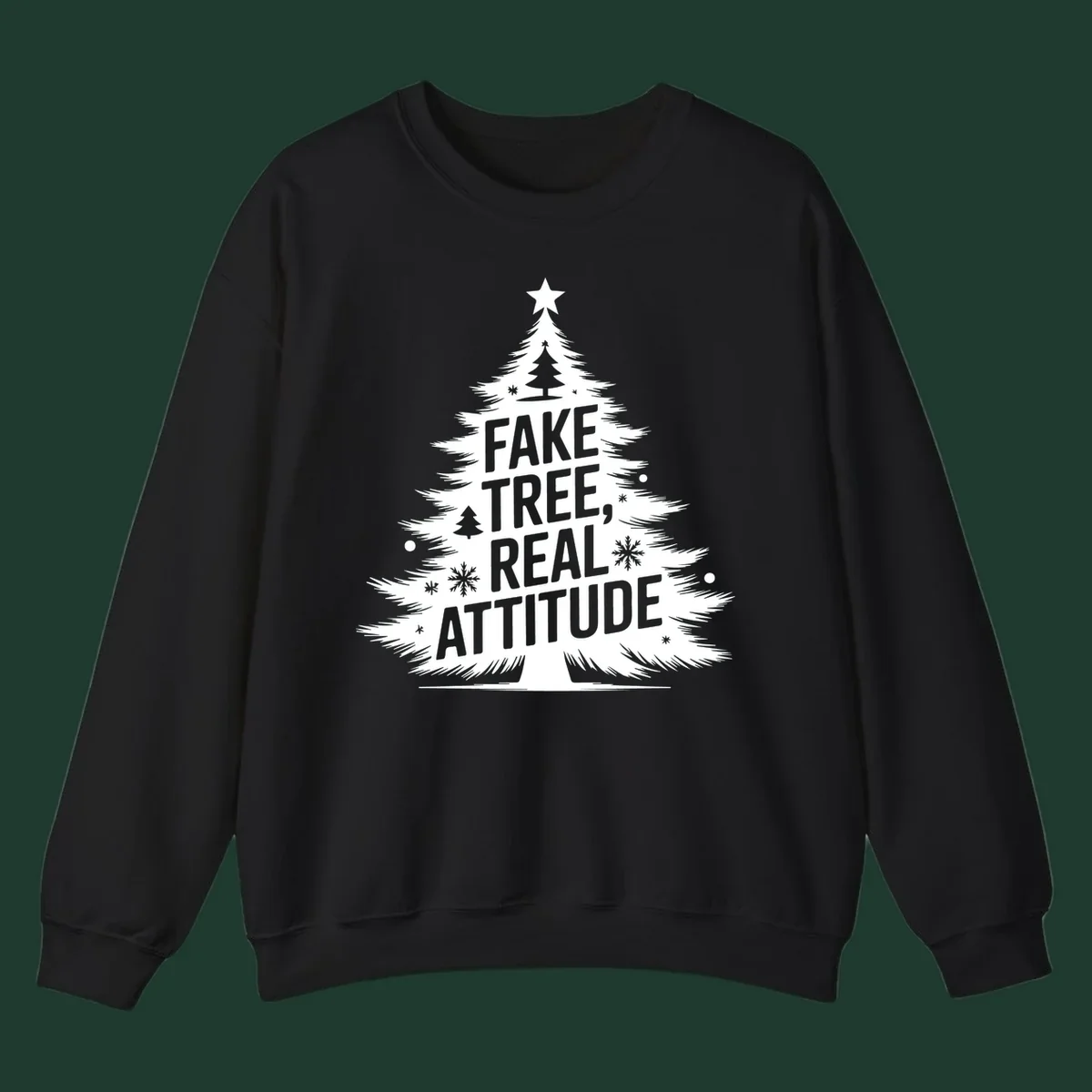 Christmas tree graphic with text 'FAKE TREE, REAL ATTITUDE' and snowflake accents.