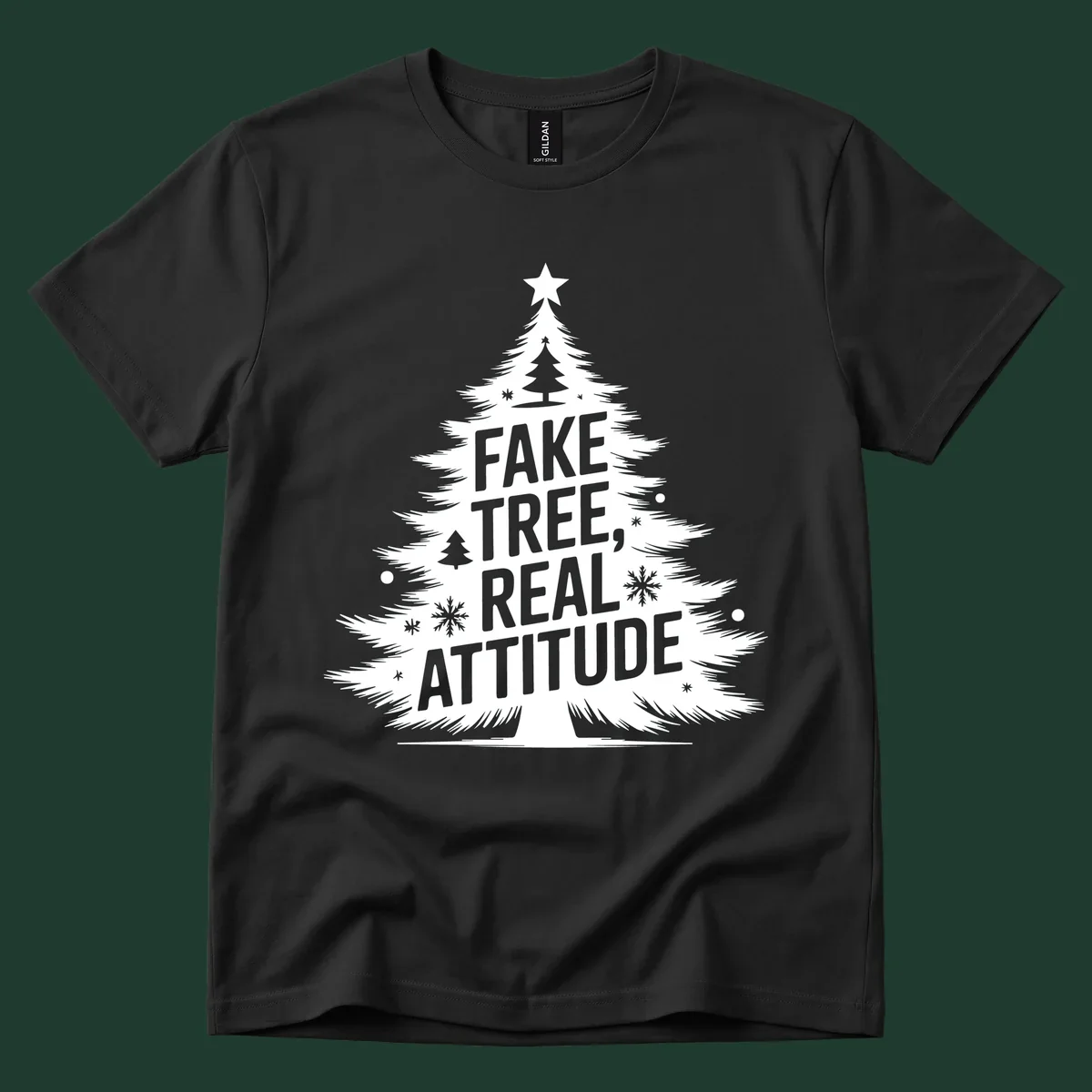 Christmas tree graphic with text 'FAKE TREE, REAL ATTITUDE' and snowflake accents.