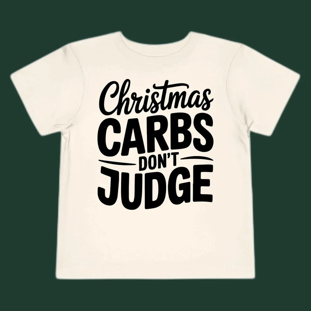 Christmas carbs don't judge phrase in white bold typography on black background.