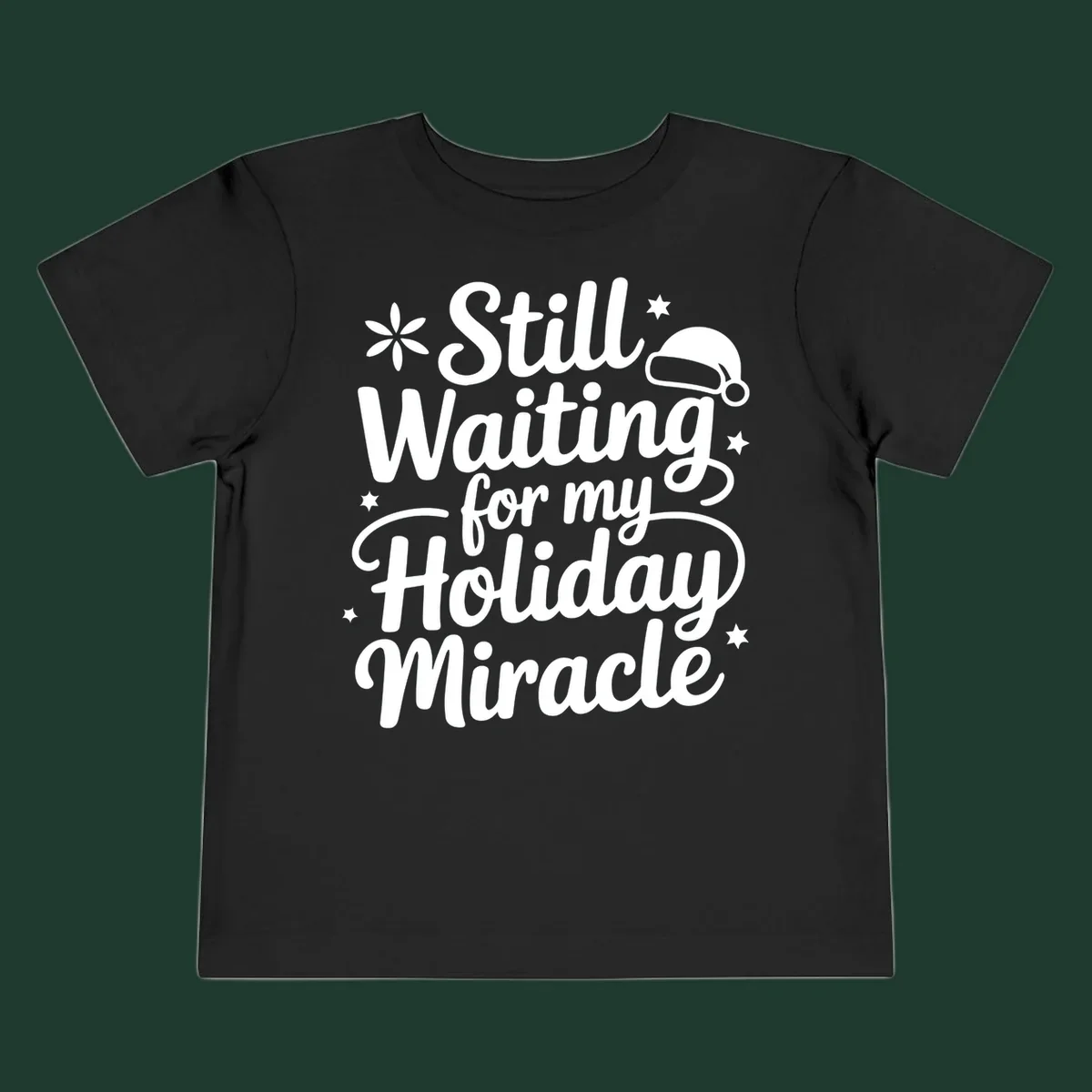 Text graphic 'Still Waiting for my Holiday Miracle' with holiday accents.