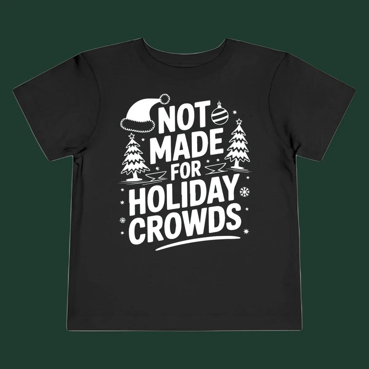 Text 'NOT MADE FOR HOLIDAY CROWDS' with Christmas graphics like a Santa hat and trees.