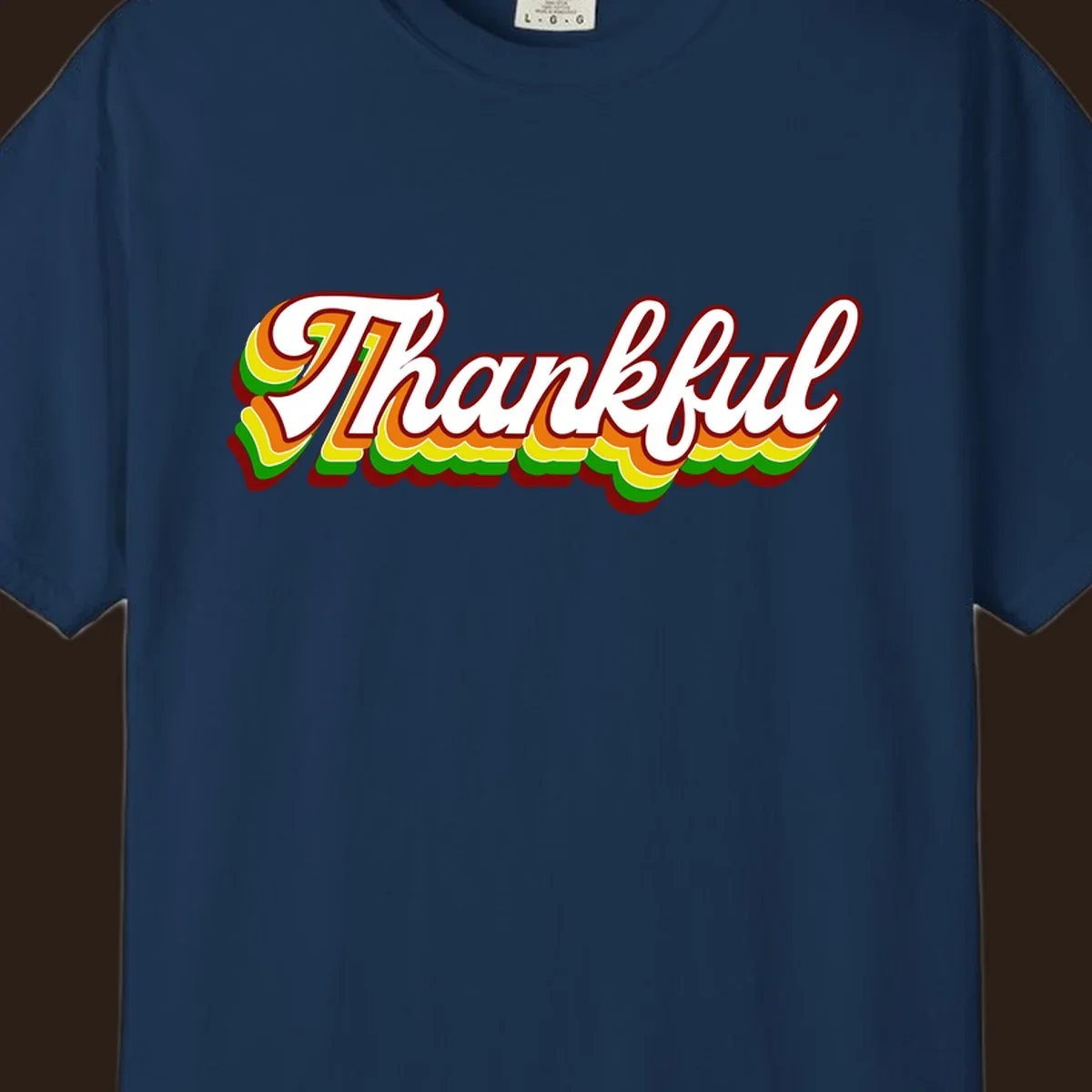 Retro thankful script text in white with colorful layered outlines and dark red shadow.