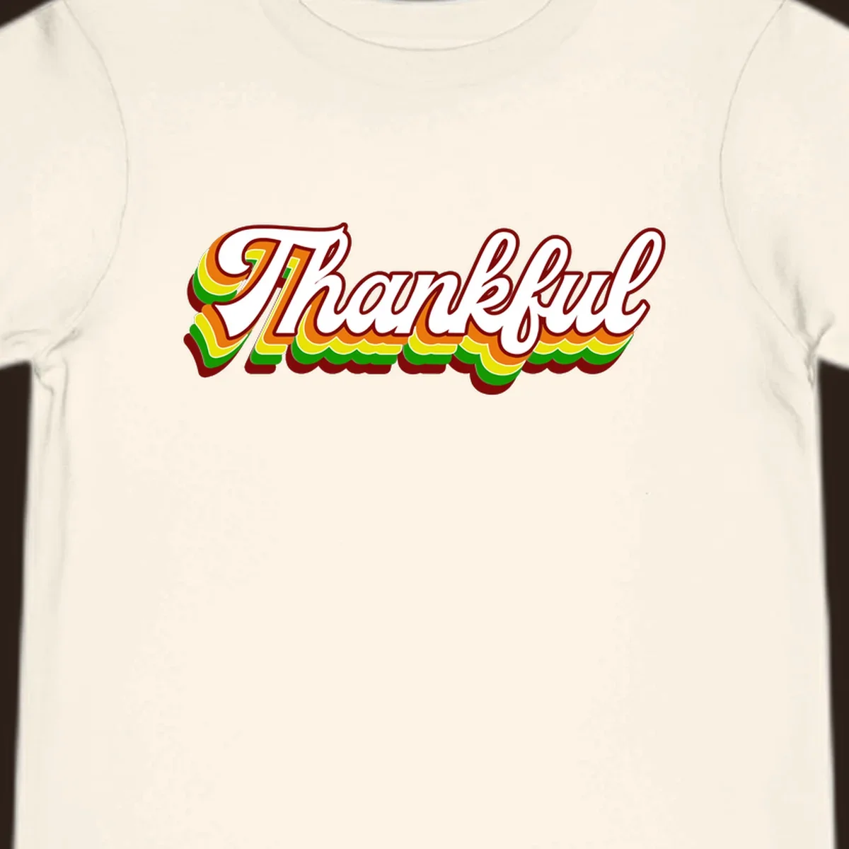Retro thankful script text in white with colorful layered outlines and dark red shadow.