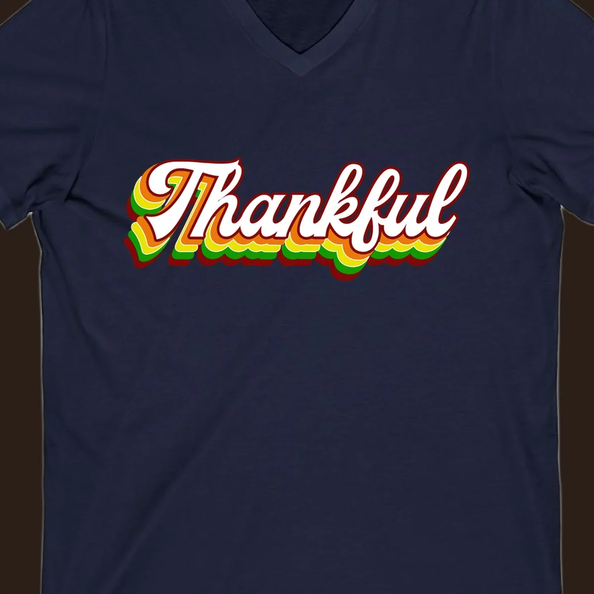 Retro thankful script text in white with colorful layered outlines and dark red shadow.