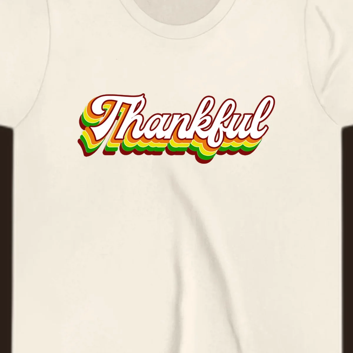Retro thankful script text in white with colorful layered outlines and dark red shadow.