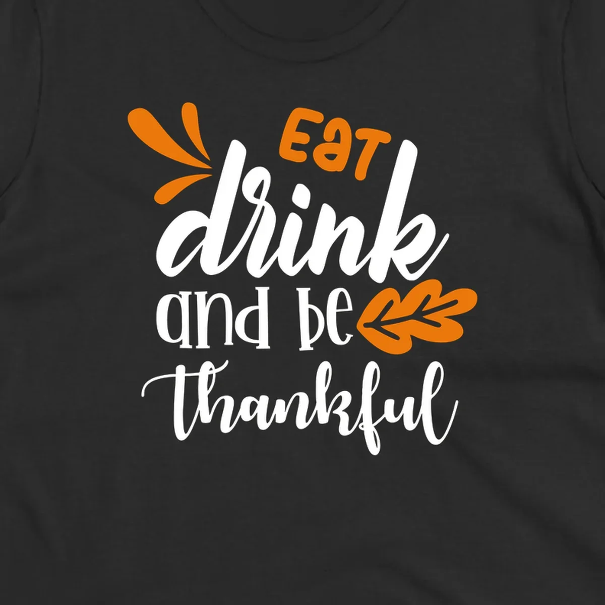 Eat Drink and Be Thankful Thanksgiving text and leaf graphic