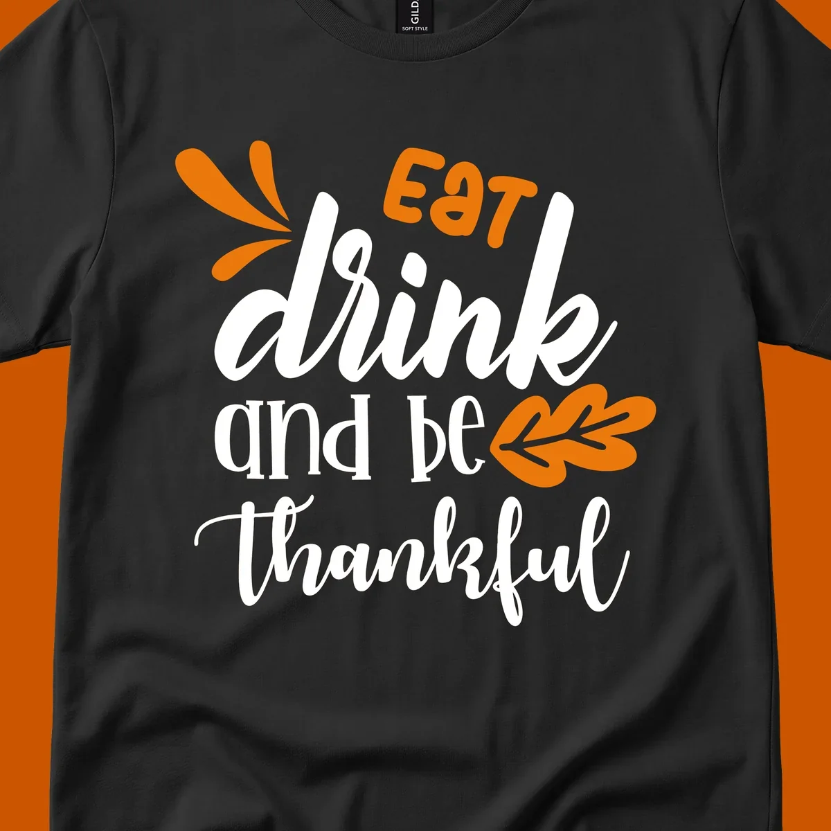 Eat Drink and Be Thankful Thanksgiving text and leaf graphic