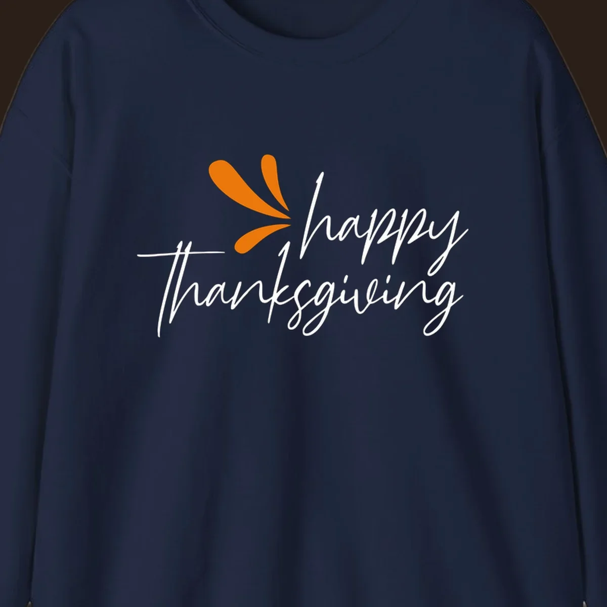 Happy Thanksgiving script text with an orange graphic element.