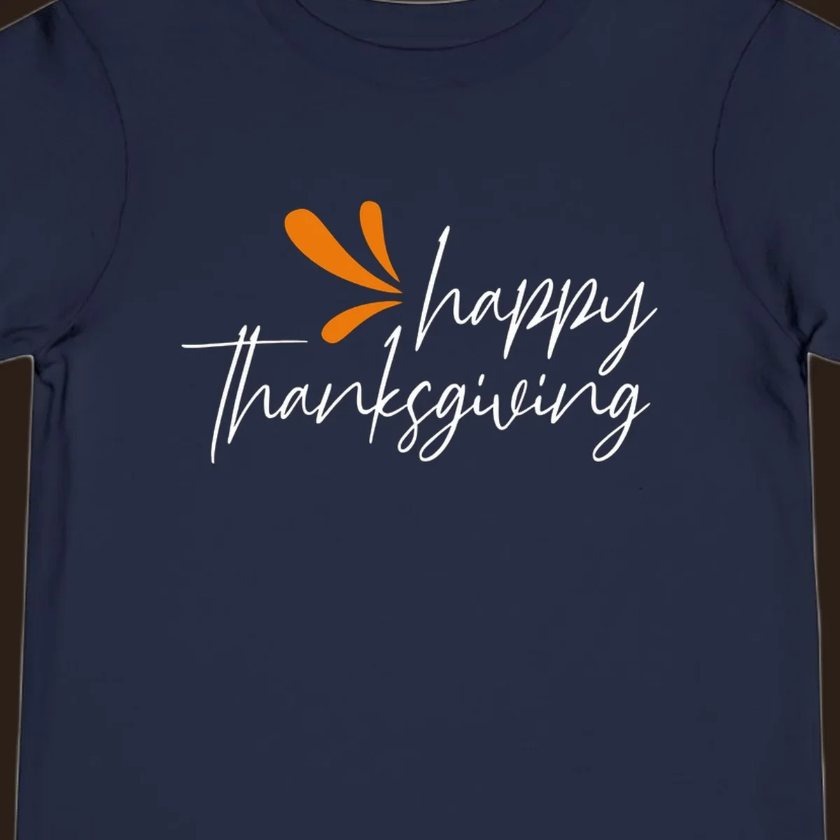 Happy Thanksgiving script text with an orange graphic element.