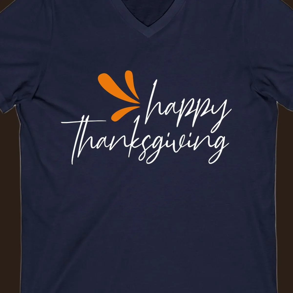 Happy Thanksgiving script text with an orange graphic element.
