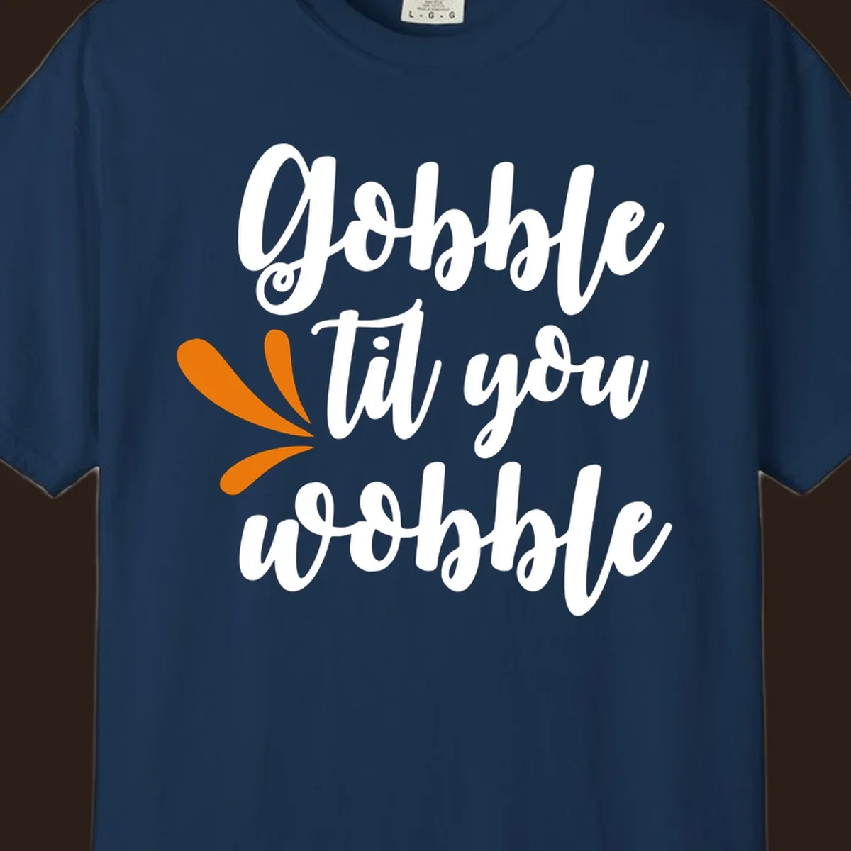 Gobble 'til you wobble Thanksgiving phrase with orange turkey feather illustrations.