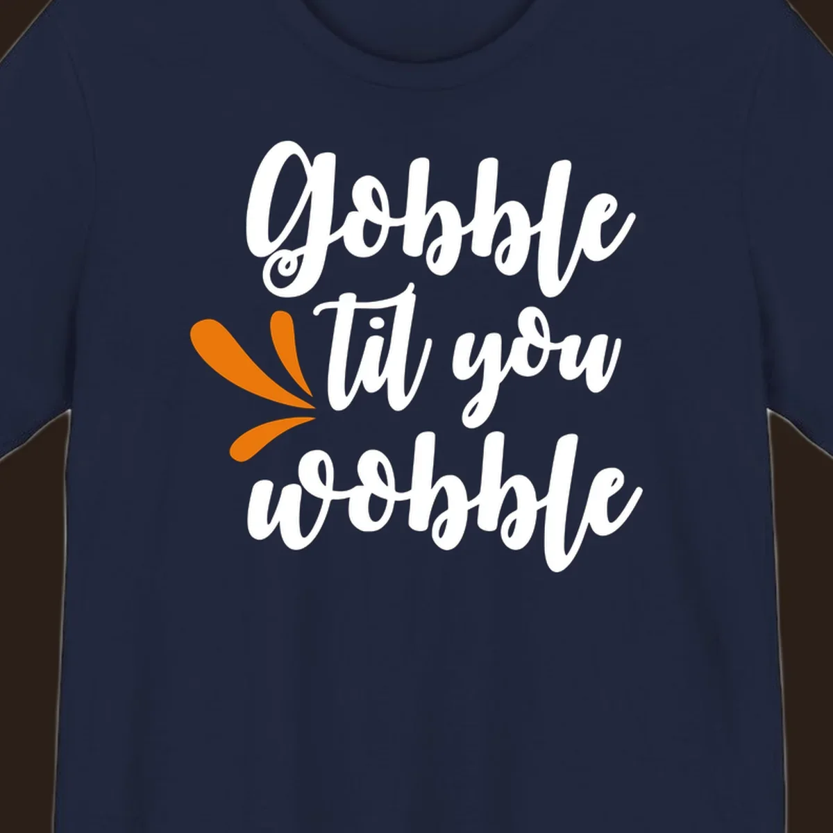 Gobble 'til you wobble Thanksgiving phrase with orange turkey feather illustrations.
