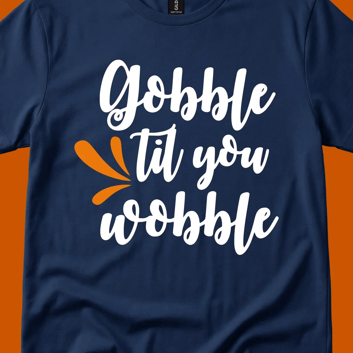 Gobble 'til you wobble Thanksgiving phrase with orange turkey feather illustrations.