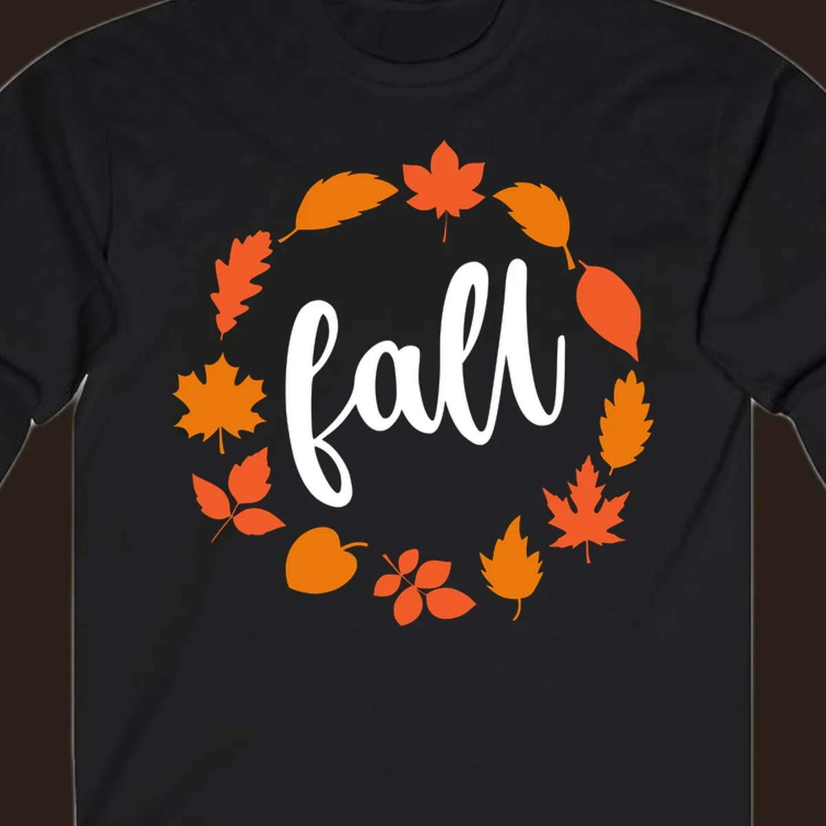 Fall leaves wreath with white script text.